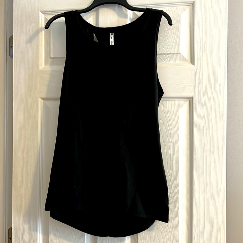 Fabletics tank with open knot detail on back.